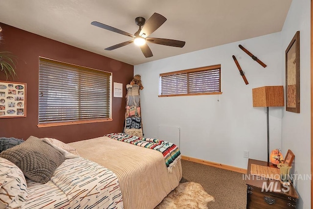 bedroom with ceiling fan and carpet