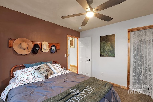 carpeted bedroom with ceiling fan