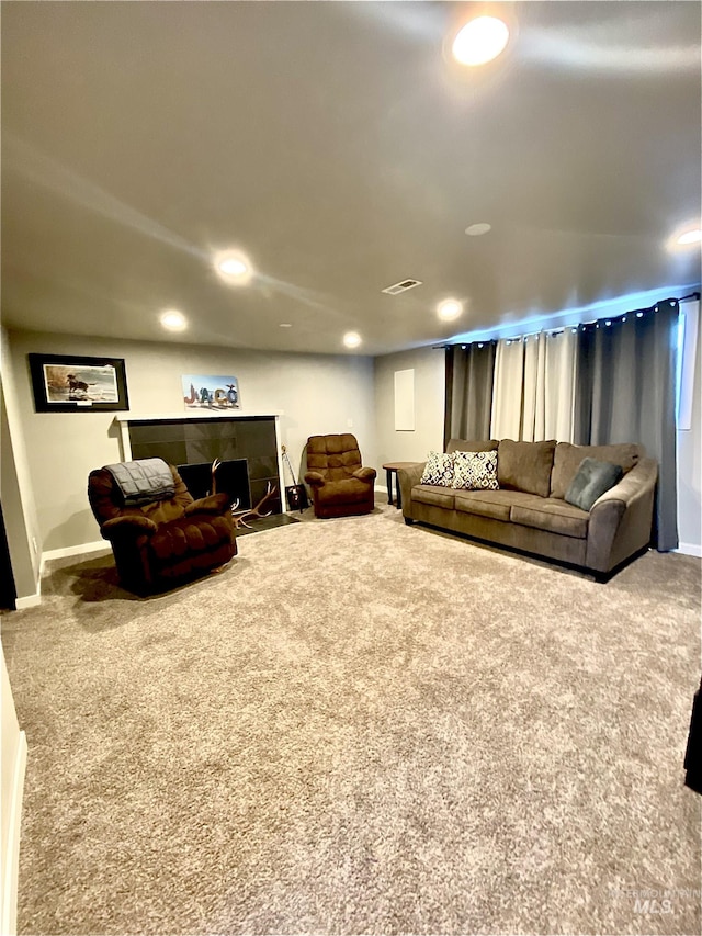 living area featuring carpet flooring, baseboards, and recessed lighting
