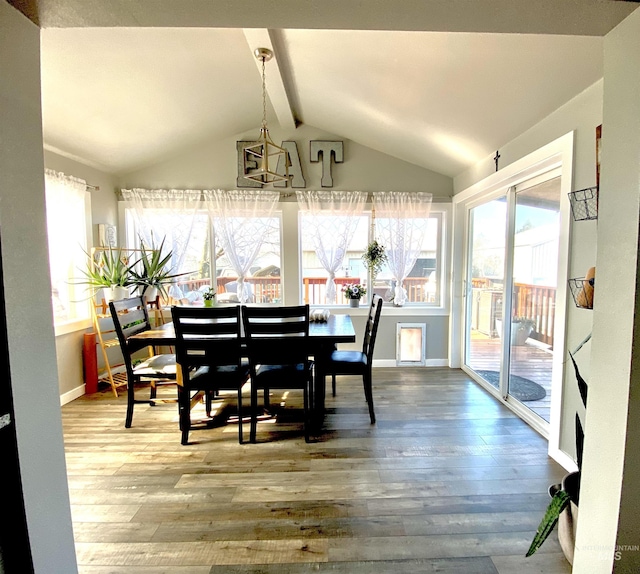 dining area with wood finished floors and baseboards