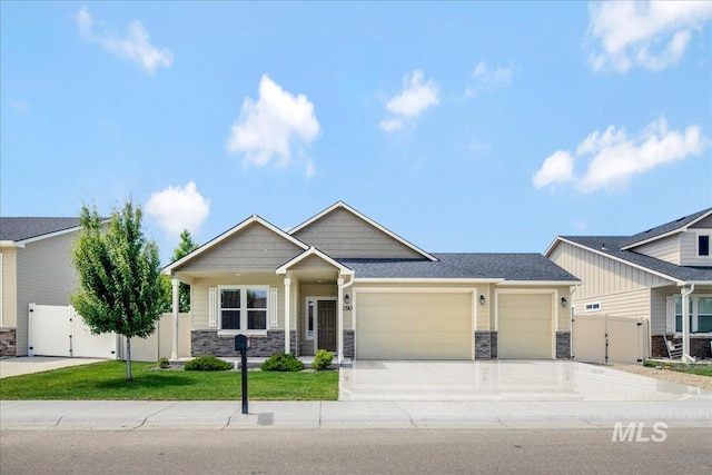 2510 Duchess Trl, Emmett, ID 83617 - craftsman-style home featuring a gate, stone siding, and a garage