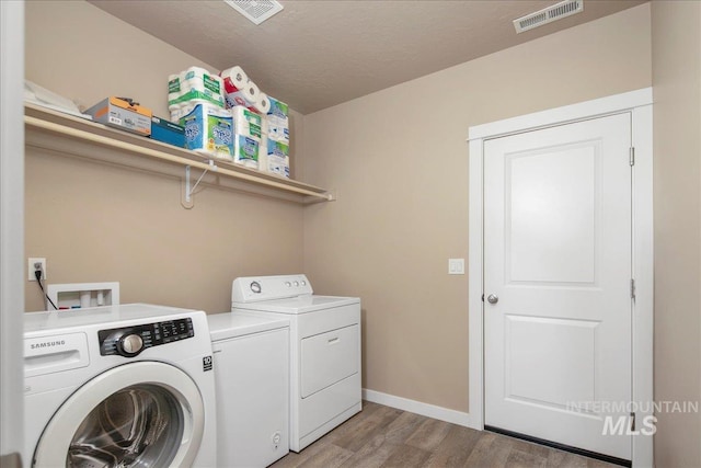 2510 Duchess Trl, Emmett, ID 83617 - washroom with washer and dryer, light wood-style floors, and baseboards