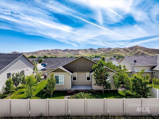 2510 Duchess Trl, Emmett, ID 83617 - view of front of property with a fenced backyard, a mountain view, and a patio area