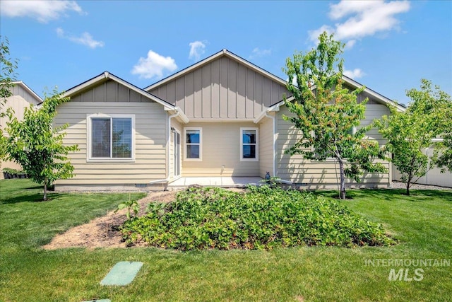 2510 Duchess Trl, Emmett, ID 83617 - back of property featuring board and batten siding, a yard, and a patio