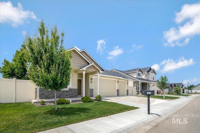 2510 Duchess Trl, Emmett, ID 83617 - view of front of home featuring an attached garage, concrete driveway, stone siding, and a residential view