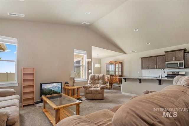 2510 Duchess Trl, Emmett, ID 83617 - living room featuring light carpet, lofted ceiling, healthy amount of natural light, and baseboards