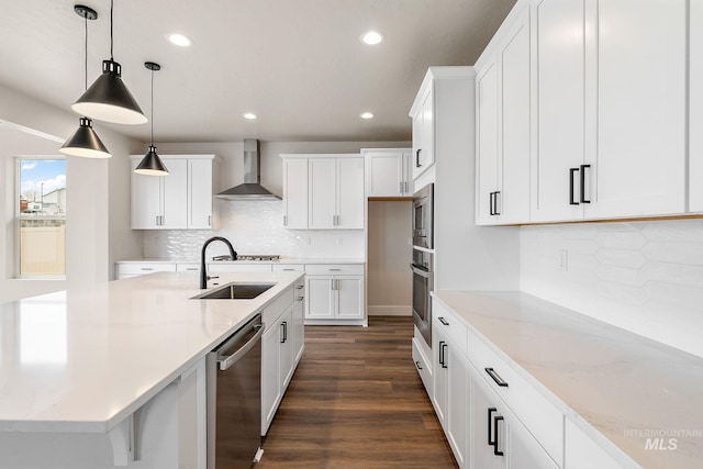 6117 N Torva Ave, Meridian, ID 83646 - kitchen featuring wall chimney range hood, stainless steel appliances, recessed lighting, white cabinets, and dark wood finished floors