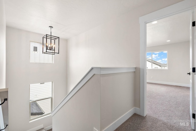 6117 N Torva Ave, Meridian, ID 83646 - stairs featuring carpet floors, baseboards, and a chandelier
