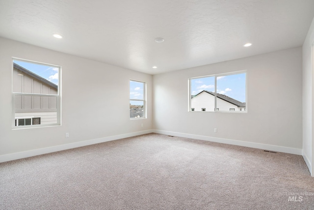 6117 N Torva Ave, Meridian, ID 83646 - unfurnished room with light carpet, baseboards, and recessed lighting