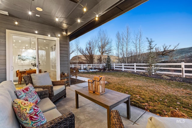 view of patio with fence and an outdoor living space