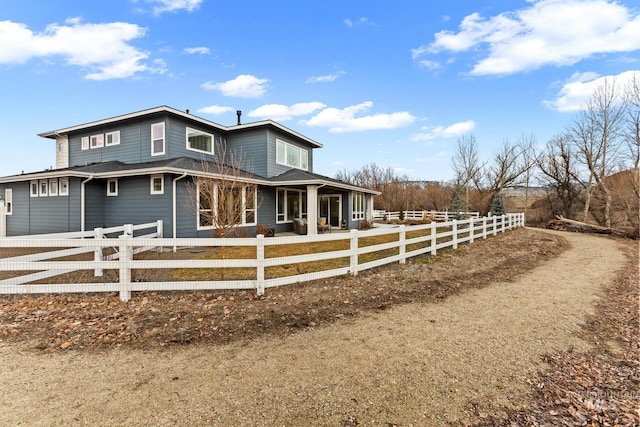 view of side of home featuring a fenced front yard