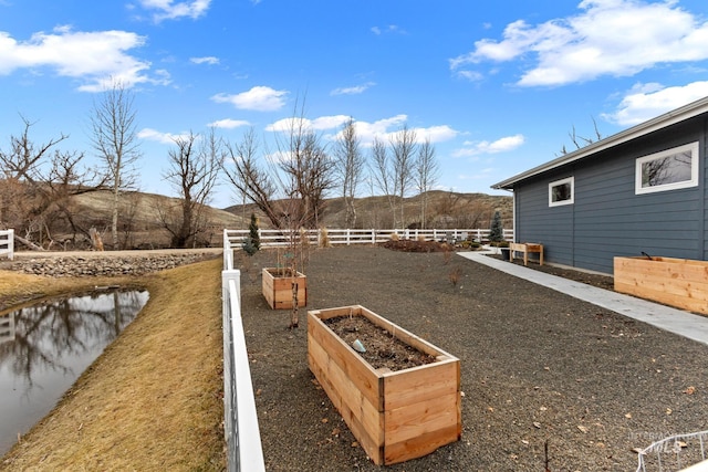 view of yard featuring a garden and fence