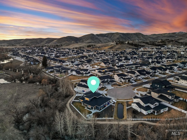 birds eye view of property with a residential view and a mountain view