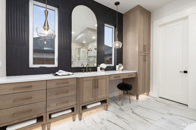 bathroom with a shower with door and vanity