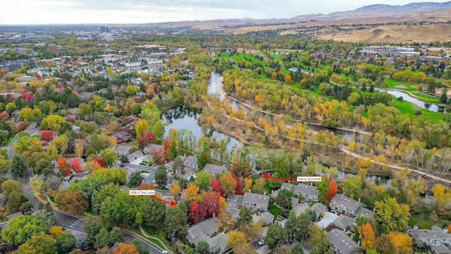 bird's eye view with a water and mountain view