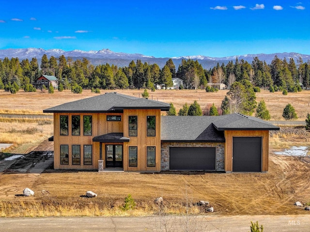 prairie-style house with a mountain view and a garage