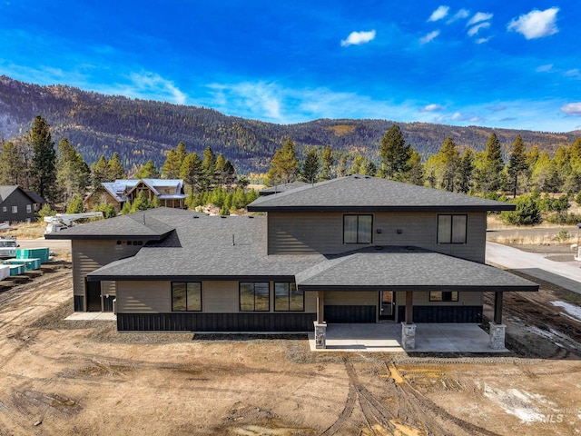 view of front facade featuring a mountain view and a patio