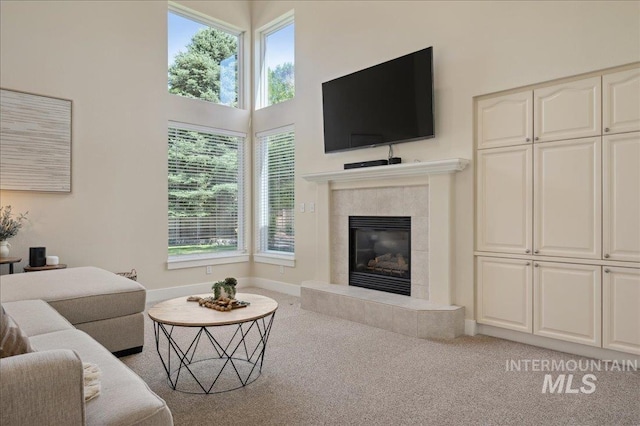 5322 N Papago Pl, Boise, ID 83713 - living room with carpet floors, plenty of natural light, a tile fireplace, and a high ceiling