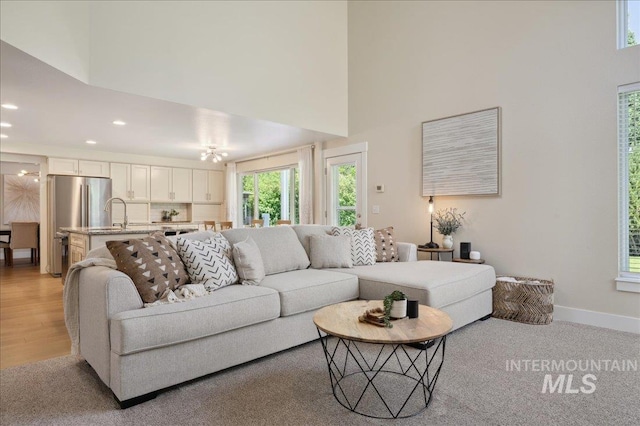 5322 N Papago Pl, Boise, ID 83713 - living room with a high ceiling, recessed lighting, and light colored carpet