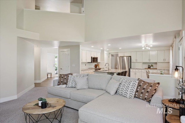 5322 N Papago Pl, Boise, ID 83713 - living room with recessed lighting, a high ceiling, and light carpet
