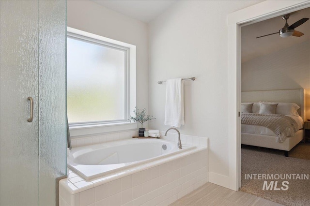 5322 N Papago Pl, Boise, ID 83713 - bathroom featuring a garden tub, connected bathroom, a ceiling fan, and a stall shower