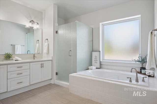 5322 N Papago Pl, Boise, ID 83713 - full bath featuring vanity, a garden tub, and a stall shower