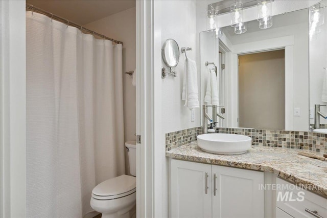 5322 N Papago Pl, Boise, ID 83713 - bathroom with vanity and decorative backsplash