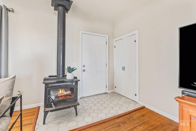 2524 Succor Creek Rd, Homedale, ID 83628 - entryway with a wood stove, baseboards, and light wood-type flooring