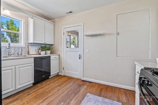 2524 Succor Creek Rd, Homedale, ID 83628 - kitchen featuring black appliances, a sink, plenty of natural light, and white cabinets