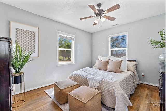 2524 Succor Creek Rd, Homedale, ID 83628 - bedroom with hardwood / wood-style flooring, baseboards, and ceiling fan