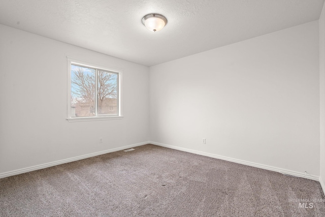 1452 E Pistioa, Meridian, ID 83642 - carpeted spare room featuring baseboards and visible vents
