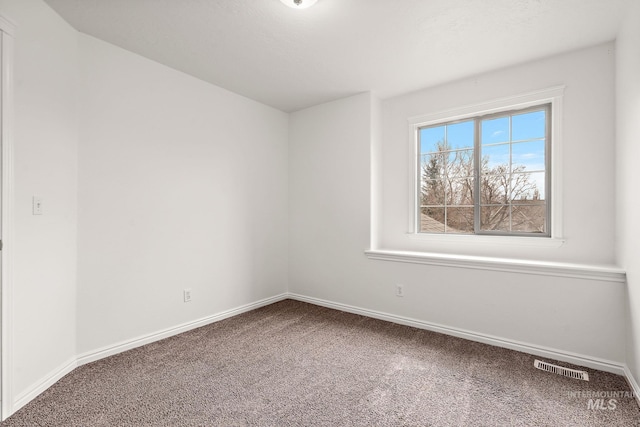 1452 E Pistioa, Meridian, ID 83642 - unfurnished room with carpet floors, baseboards, and visible vents
