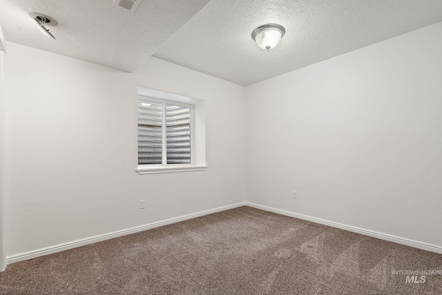 1452 E Pistioa, Meridian, ID 83642 - unfurnished room with carpet flooring, a textured ceiling, and baseboards