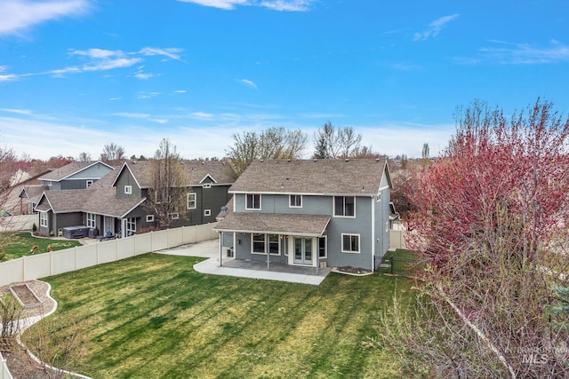 1452 E Pistioa, Meridian, ID 83642 - back of house featuring a lawn, a shingled roof, a fenced backyard, and a patio area