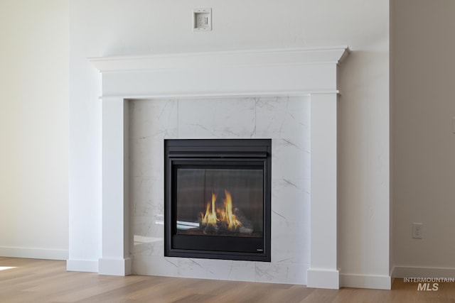 8709 W Pickett Creek St, Star, ID 83669 - detailed view of a high end fireplace and wood finished floors