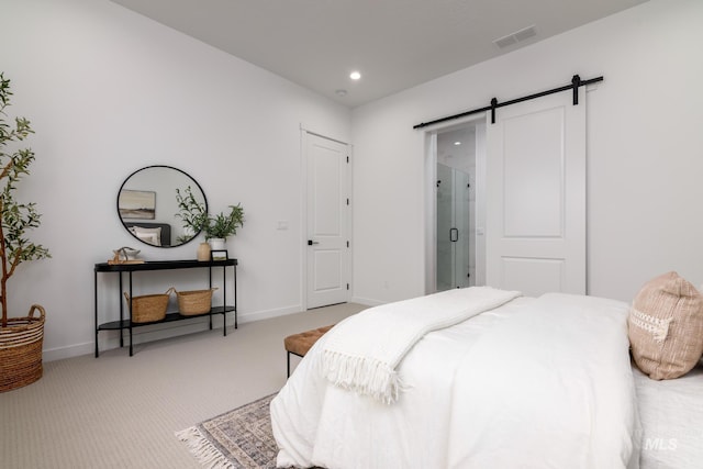 8709 W Pickett Creek St, Star, ID 83669 - carpeted bedroom with a barn door, recessed lighting, and connected bathroom