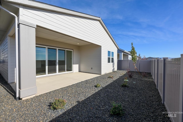 8709 W Pickett Creek St, Star, ID 83669 - back of house with a fenced backyard and a patio