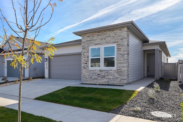8709 W Pickett Creek St, Star, ID 83669 - view of front facade with stone siding, an attached garage, and concrete driveway