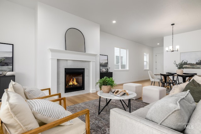8709 W Pickett Creek St, Star, ID 83669 - living area featuring a chandelier, a fireplace, light wood-style floors, and recessed lighting