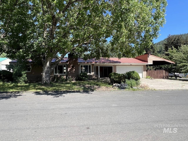 single story home with a garage