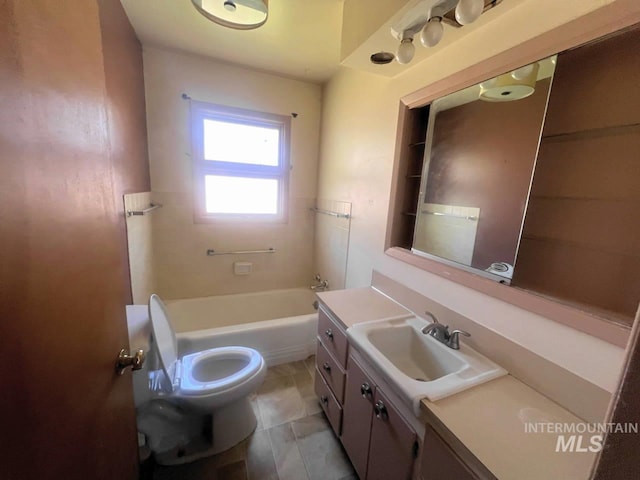 bathroom featuring tile patterned flooring, vanity, and toilet