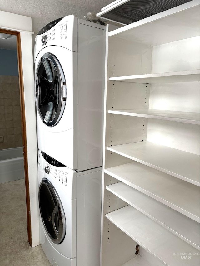 616 E 8th, Moscow, ID 83843 - clothes washing area with stacked washer / dryer
