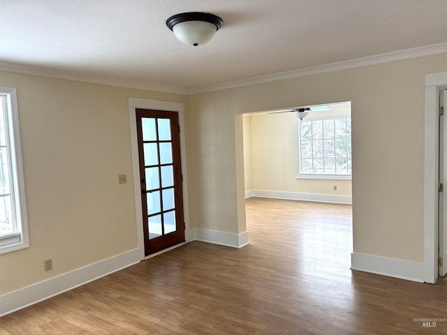 616 E 8th, Moscow, ID 83843 - spare room featuring ornamental molding, wood finished floors, and baseboards