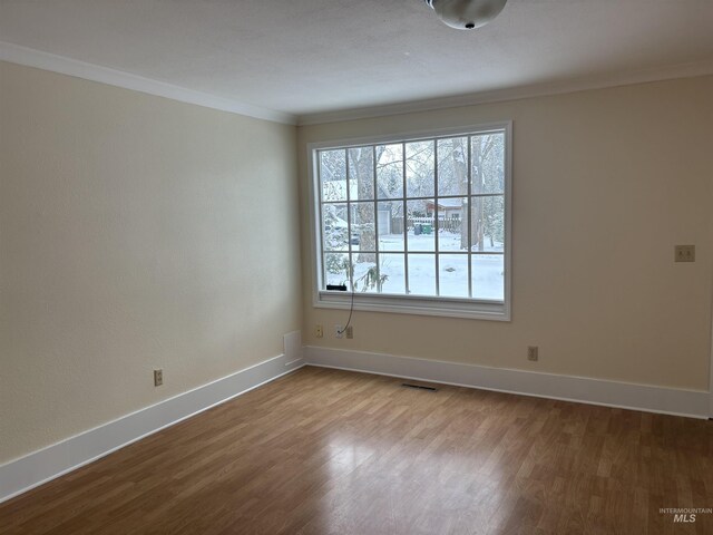 616 E 8th, Moscow, ID 83843 - spare room featuring ornamental molding, dark wood-style floors, and baseboards