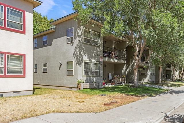 9200 W Brogan Dr Unit A & B, Boise, ID 83709 - view of property exterior with crawl space, stucco siding, and a balcony
