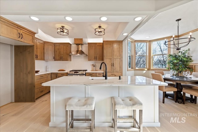 79 E Aikens Rd, Apt Eagle, ID 83616 - kitchen featuring brown cabinets, light countertops, stainless steel range, a breakfast bar area, and recessed lighting