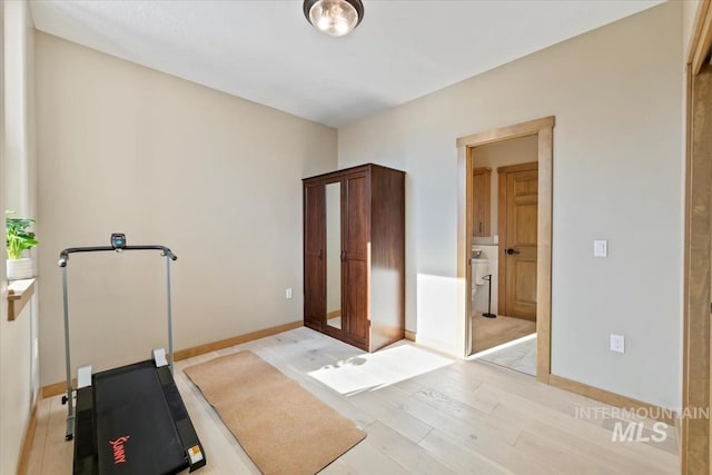 79 E Aikens Rd, Apt Eagle, ID 83616 - workout room featuring light wood-type flooring and baseboards