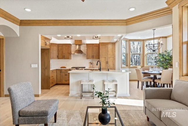 79 E Aikens Rd, Apt Eagle, ID 83616 - living room featuring a chandelier, crown molding, light wood-style flooring, and recessed lighting