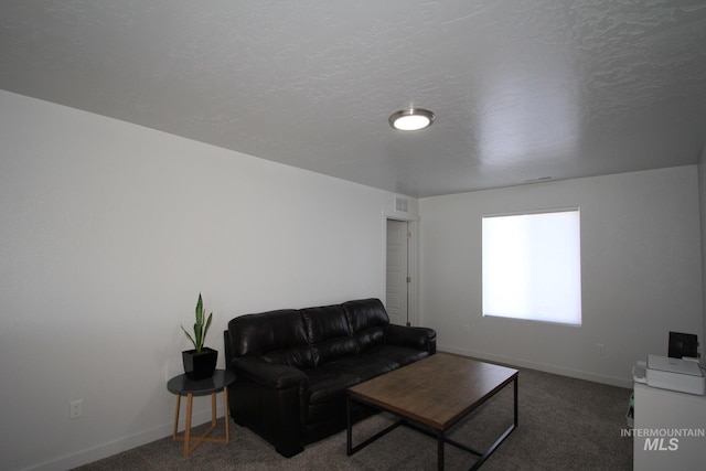 living area featuring carpet, visible vents, and baseboards