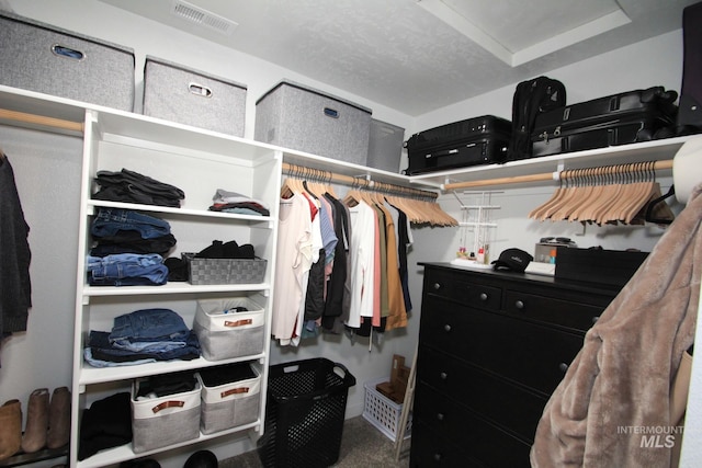 walk in closet with visible vents